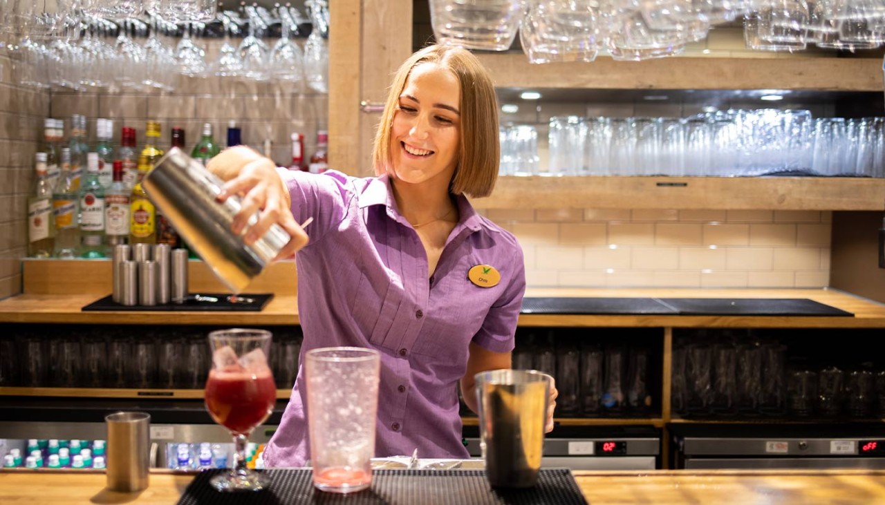 Bar staff creating a cocktail