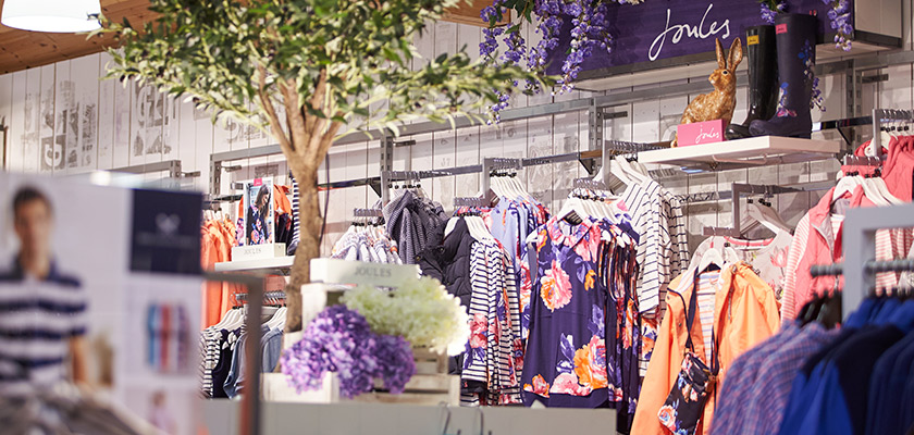 Joules clothing hanging up in the retail shop 