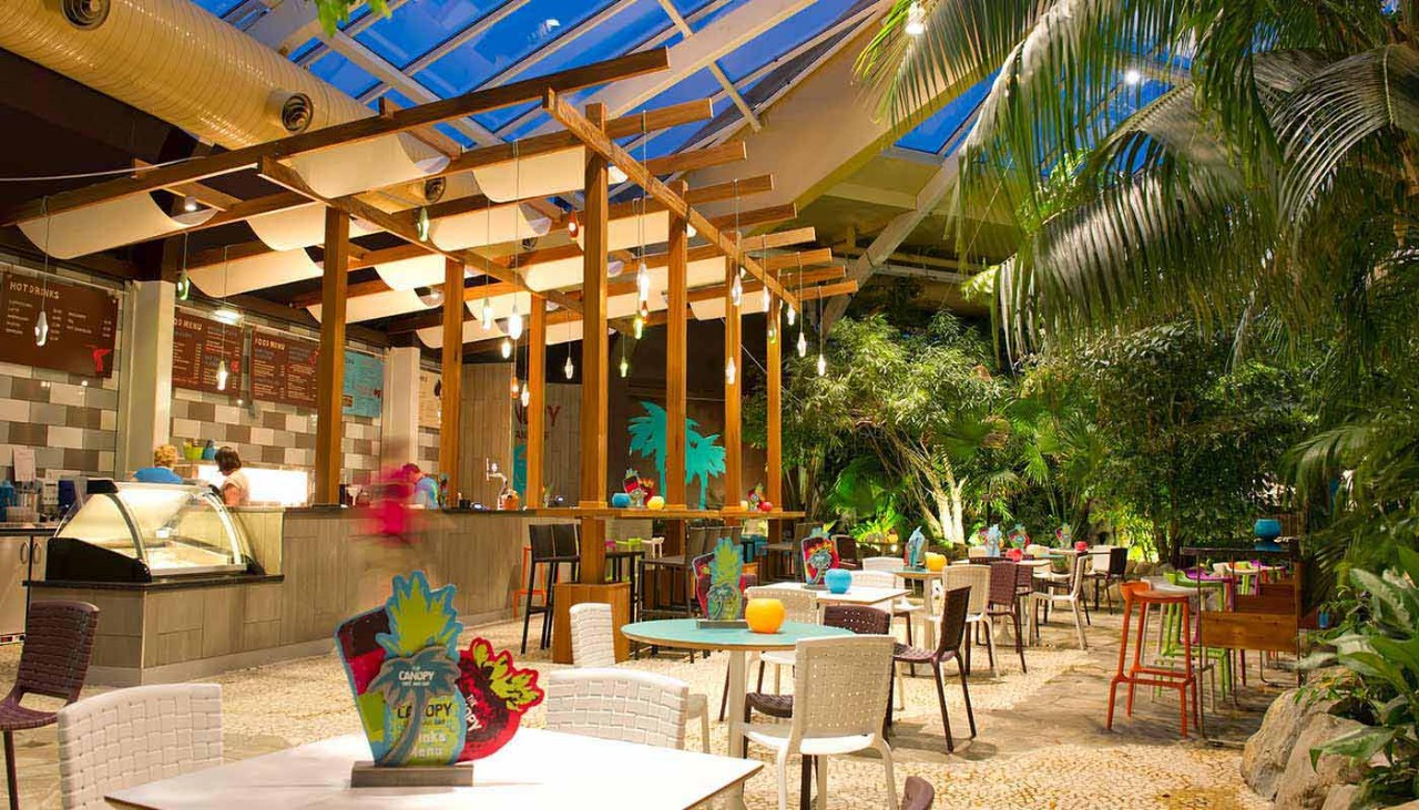 Canopy Cafe seating area within the Subtropical Swimming Paradise