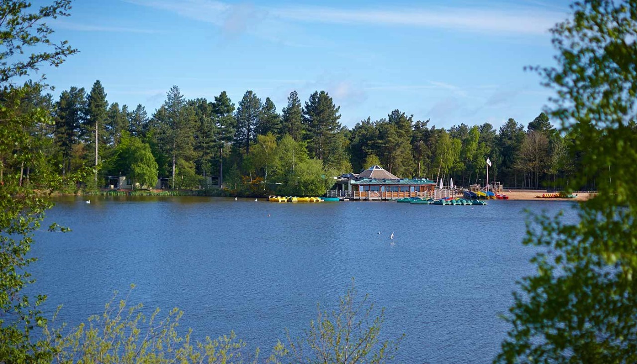 View of the lake with the the Pancake House, beach and forest in the distance