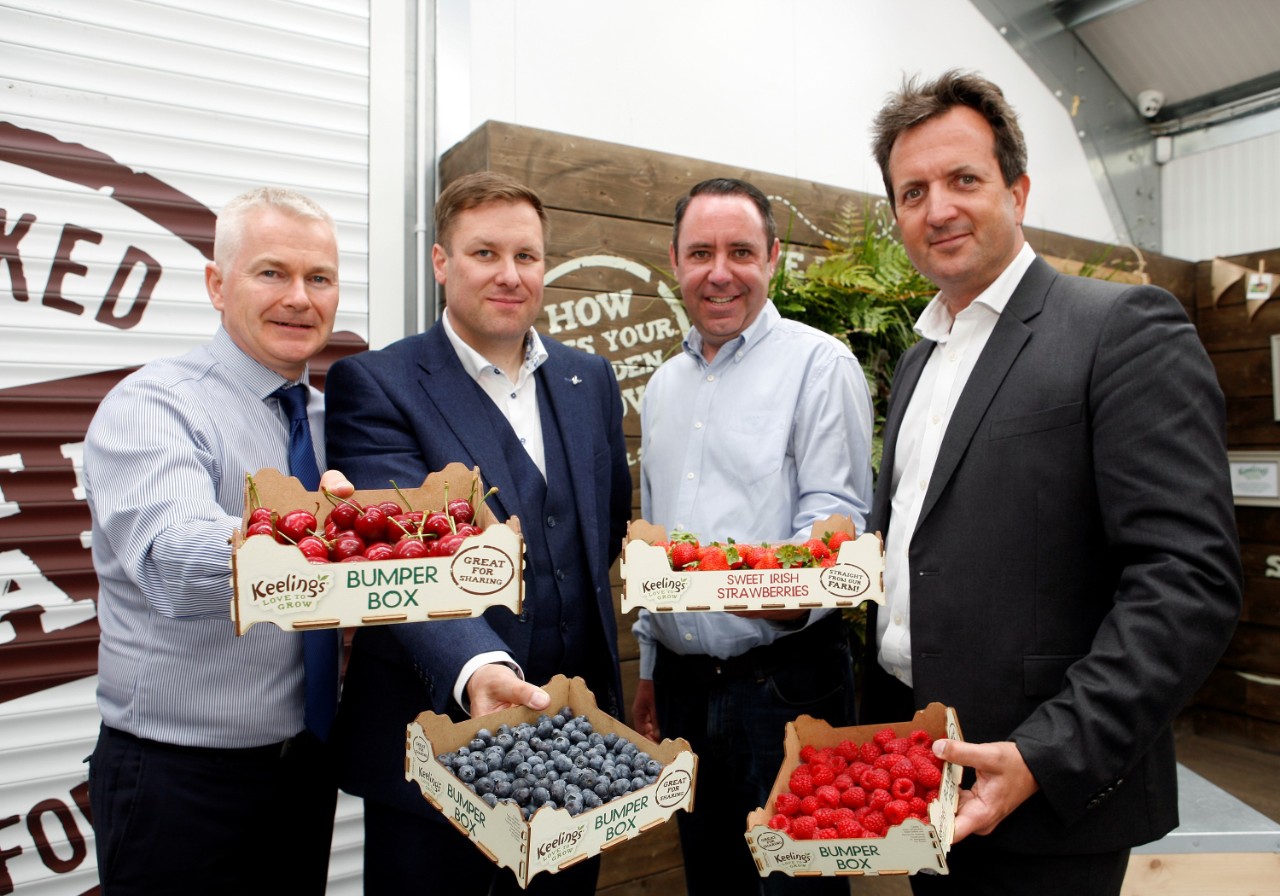 Center Parcs employees holding fruit from local suppliers 