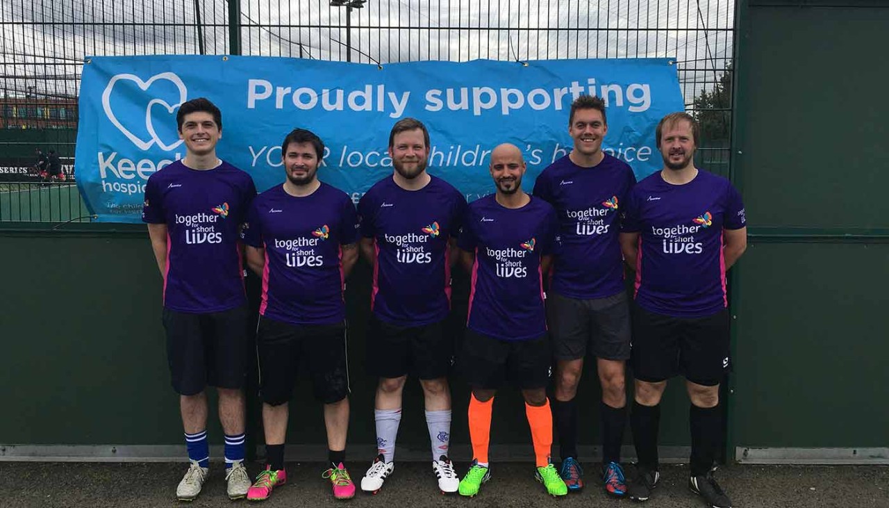 Mens 5 a-side team wearing charity football kit
