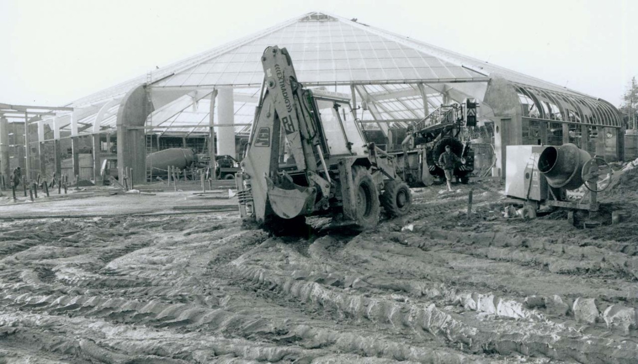 A black and white photo of a digger doing construction at Elveden Forest 